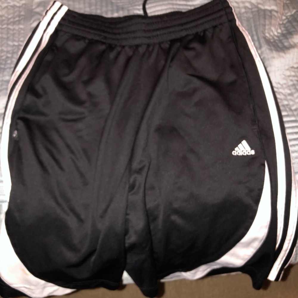Black adidas shorts.